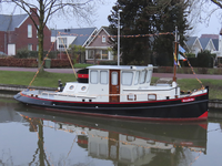 902026 Afbeelding van het met kerstlichtjes versierde sleepbootje 'Rosa Bella', aangemeerd in de Leidsche Rijn bij de ...